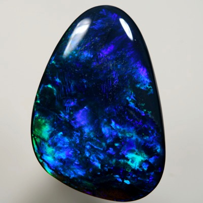 SOLID BLACK OPAL Gem quality opal. Bright strong peacock fire in a Flame pattern SEE VIDEO
